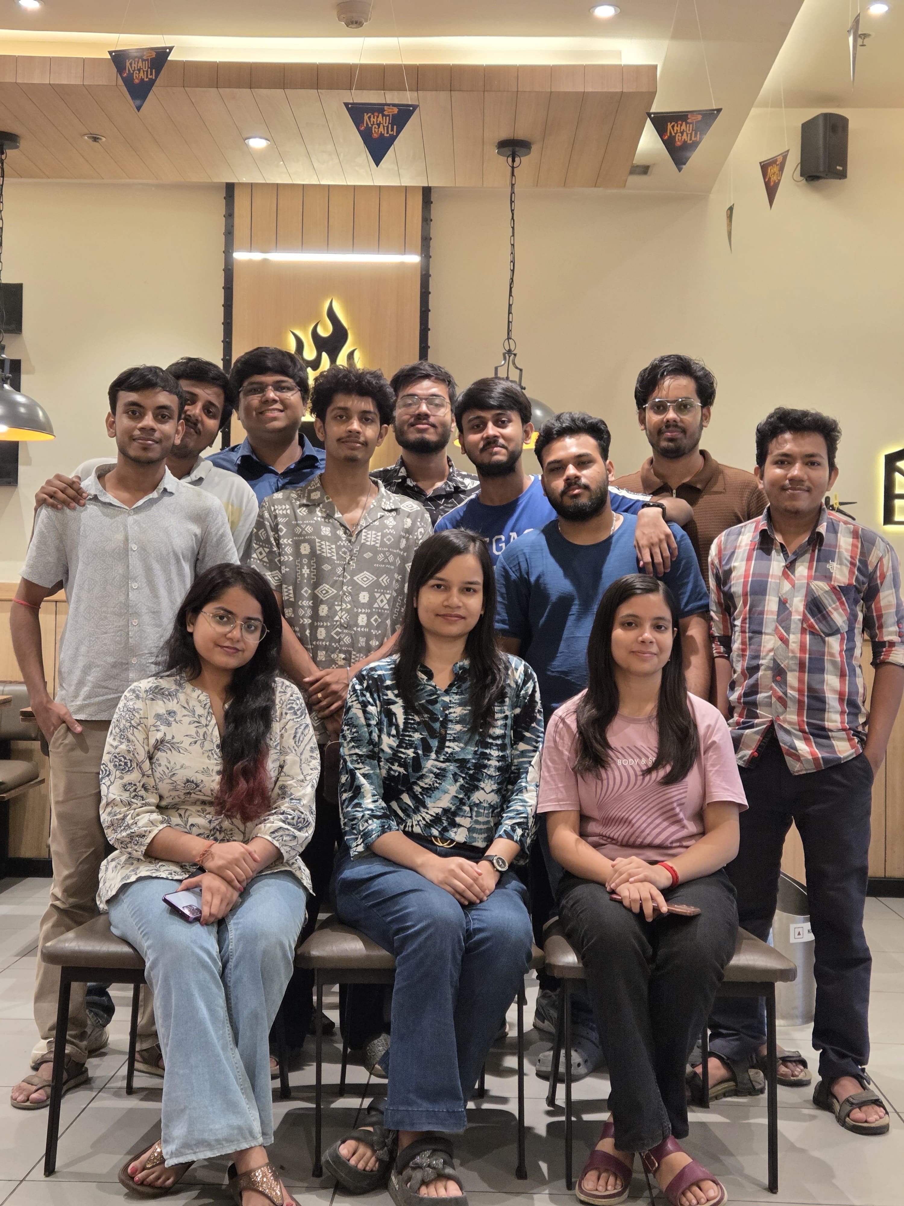 A diverse team of professionals meeting and collaborating in a modern, bright office.